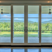 glass doors facing a beautiful mountain view